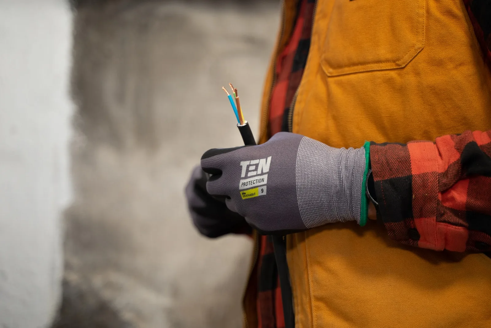 a person holding a pair of wires in their hands